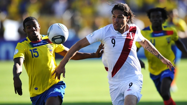 Peru's Paolo Guerrero (R) vies for the ball with Ecuador's Jairo Campos, during the Brazil 2014 FIFA World Cup South American qualifier match at the Olimpico Atahualpa stadium in Quito, on November 15, 2011.  AFP PHOTO / RODRIGO BUENDIA