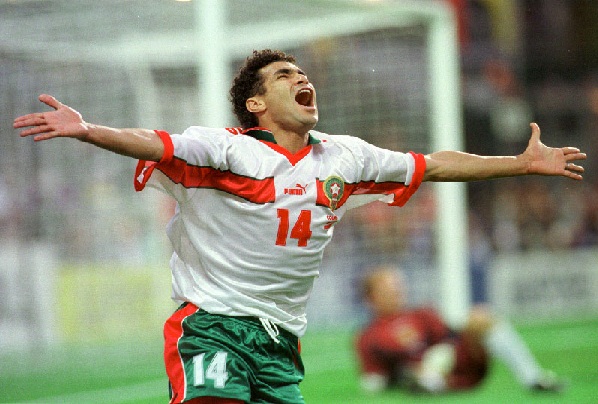 Morocco's Salaheddine Bassir begins celebrating his goal during the Scotland vs Morocco, Group A, World Cup 98, soccer match at Geoffroy Guichard Stadium in Saint Etienne, Tuesday, June 23, 1998. The other teams in Group A are Brazil and Norway. (AP Photo/Denis Doyle)