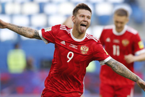 Russia's Fedor Smolov celebrates after scoring his side's second goal during the Confederations Cup, Group A soccer match between Russia and New Zealand, at the St. Petersburg Stadium, Russia, Saturday, June 17, 2017. (AP Photo/Pavel Golovkin)