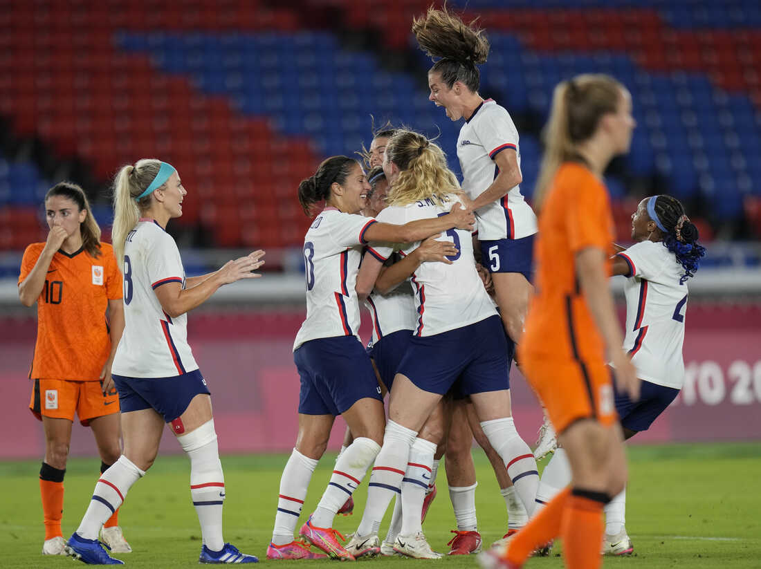 United States' players celebrate a goal scored by teammate Lynn Williams during a women's quarterfinal soccer match against Netherlands at the 2020 Summer Olympics, Friday, July 30, 2021, in Yokohama, Japan. (AP Photo/Silvia Izquierdo)