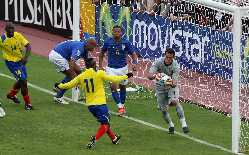 Brazilian goalkeeper Julio Cesar (R) catches the ball under the pressure of Ecuadorean Cristian Benitez during a FIFA World Cup South Africa-2010 qualifier football match at the Atahualpa Olympic stadium in Quito, Ecuador on March 29, 2009. Ecuador and Brazil tied 1-1.  AFP PHOTO / VANDERLEI ALMEIDA (Photo credit should read VANDERLEI ALMEIDA/AFP/Getty Images)